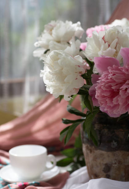 istock Still life with white and pink peonies in a old vase 1390791344