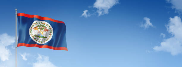 istock Belize flag isolated on a blue sky. Horizontal banner 1390792342