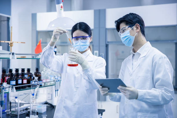 istock Asian scientists working in a medical laboratory 1390792440