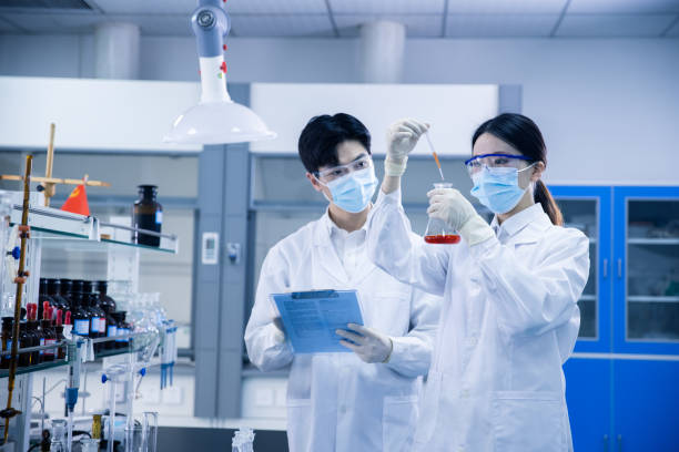 istock Asian scientists working in a medical laboratory 1390792645