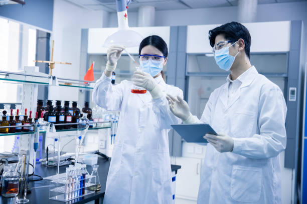istock Asian scientists working in a medical laboratory 1390792700