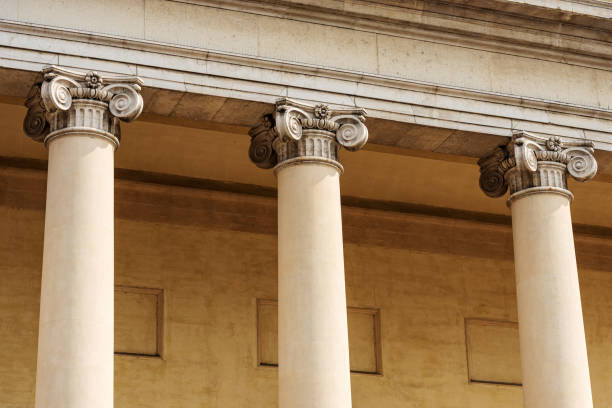 Close-up of Three Ionic Columns - Facade of Treviso Cathedral Italy Close-up of three columns with Ionic capitals. Facade and pronaos of Treviso Cathedral (Duomo o Cattedrale di San Pietro Apostolo - Saint Peter the Apostle), VI-XIX century, Veneto, Italy, Europe. church of san pietro photos stock pictures, royalty-free photos & images