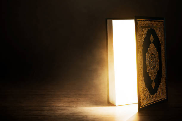 Quran holy book on dark background stock photo