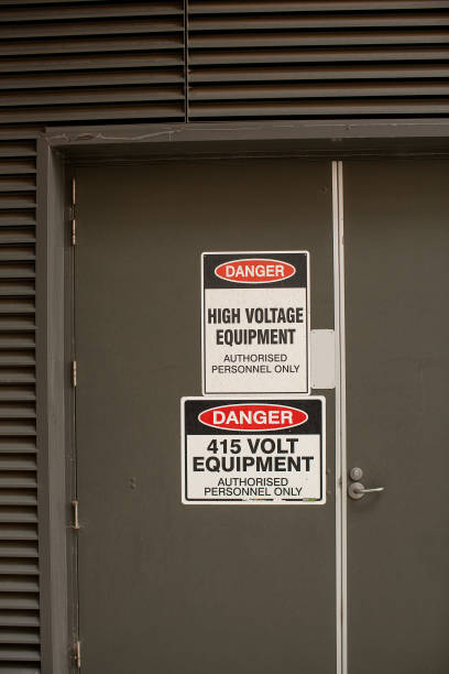 istock Danger High Voltage warning signs attached to access door 1390800562