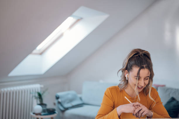 istock Woman having web call on a laptop while working at home 1390801312