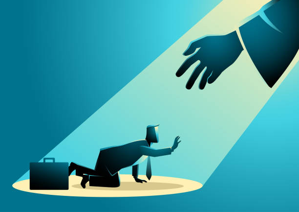 istock Businessman sitting on suitcase sadly and hand reaching him from the light 1390801535