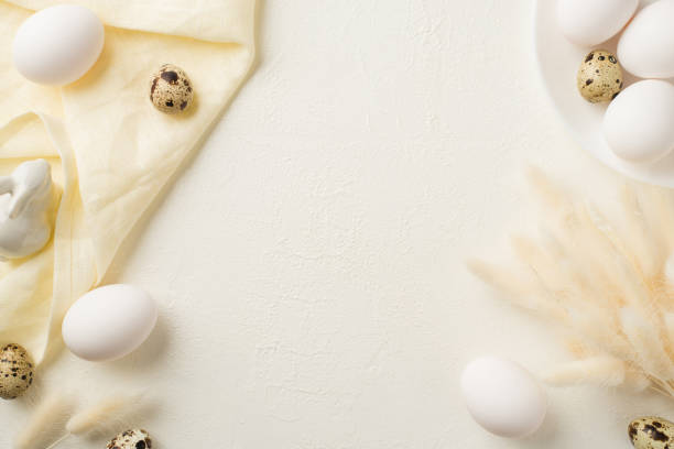 istock Top view photo of easter decorations lagurus flowers ceramic easter bunny eggs plate and linen on isolated white background with blank space 1390801847