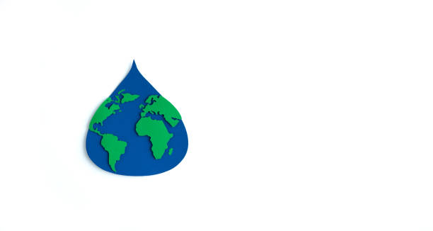 istock Paper cutout water drop with world map inside on white background. Copy space. Earth day. International Earth Day. 1390802059