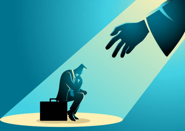 istock Businessman sitting on suitcase sadly and hand reaching him from the light 1390803208