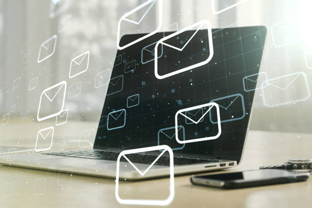 istock Creative concept of postal envelopes illustration on modern laptop background. Email and communications concept. Multiexposure 1390804819