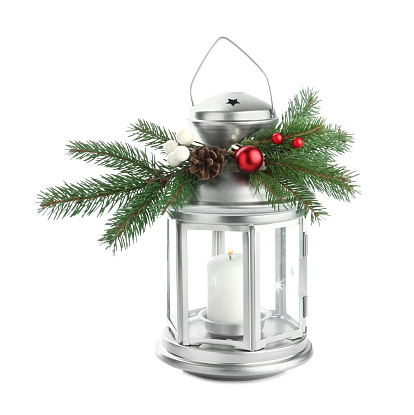 Lantern with Christmas decorations isolated on white