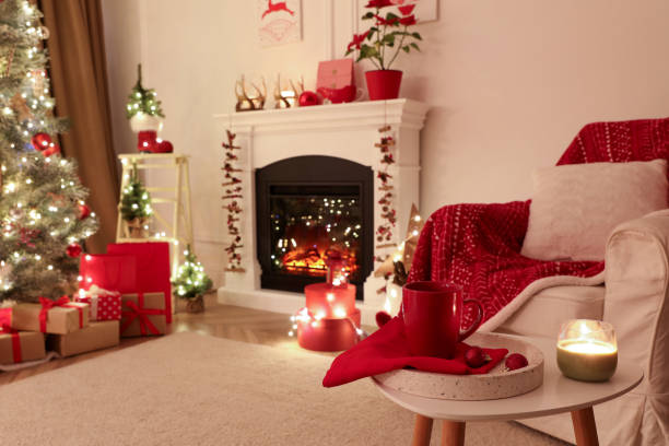 istock Living room with fireplace and Christmas decorations. Festive interior design 1390808887