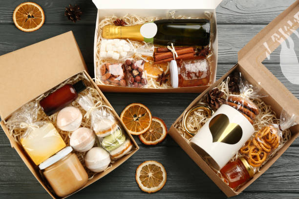 istock Stylish gift sets on grey wooden table, flat lay 1390809164