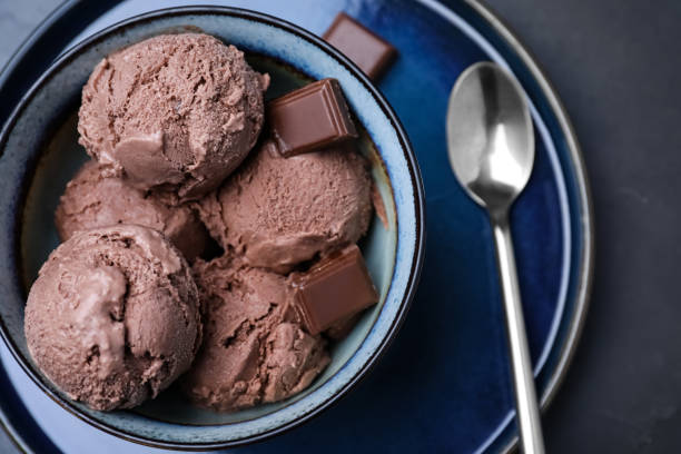 istock Yummy chocolate ice cream served on black table, top view 1390810161