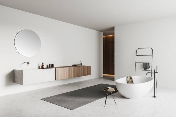 istock Corner view on bright bathroom interior with bathtub, shower, mirror 1390810688
