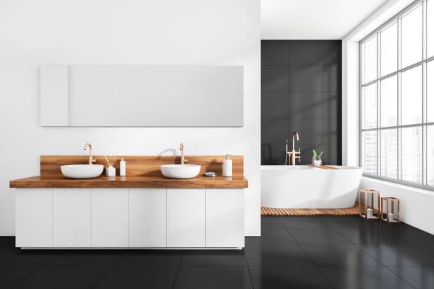 istock Modern bathroom interior with sink and bathtub near panoramic window 1390810781
