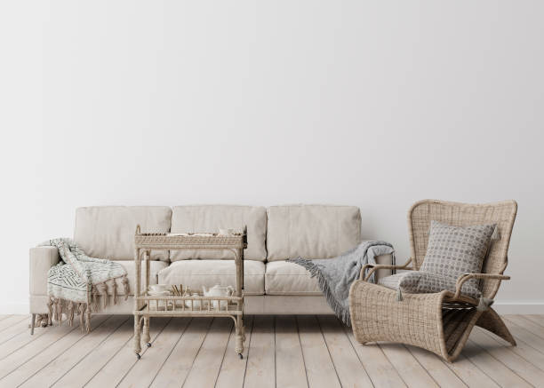 istock Empty white wall in modern living room. Mock up interior in scandinavian, boho style. Free, copy space for your picture, text, or another design. Sofa, rattan armchair, macrame. 3D rendering. 1390811825