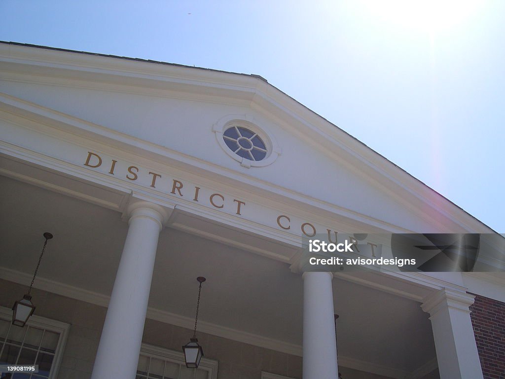 Gazing up at the pillars and roof of the district courthouse Court House in the Summer Courthouse Stock Photo