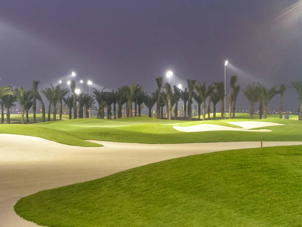 With 11 of the 18 holes meandering around a mangrove reserve, Tower Links Golf Course in Ras Al Khaimah is the premier golf course in the northern emirates of the UAE. With 11 of the 18 holes meandering around a mangrove reserve, Tower Links Golf Course in Ras Al Khaimah is the premier golf course in the northern emirates of the UAE. night golf stock pictures, royalty-free photos & images