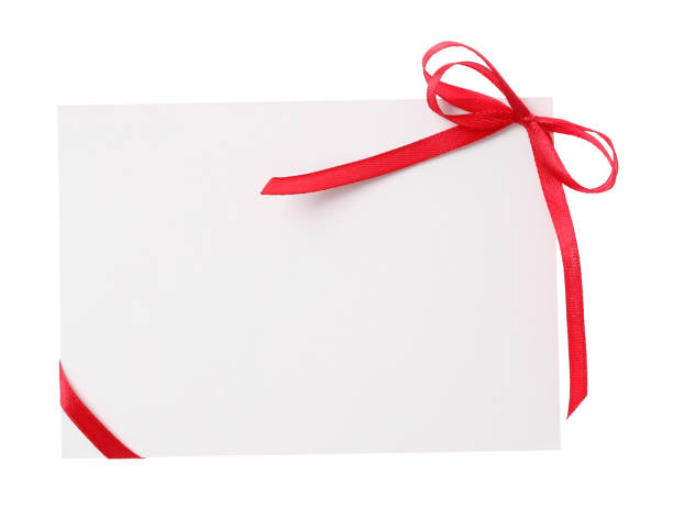 istock Blank card with red bow on white background, top view. Valentine's Day celebration 1390815562