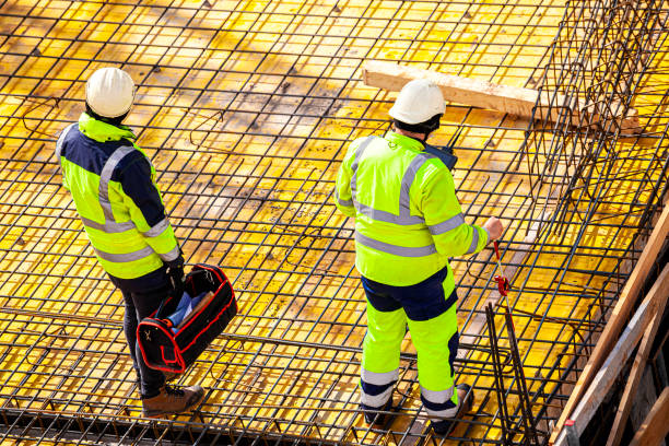 istock Surveyors at the construction site 1390815806