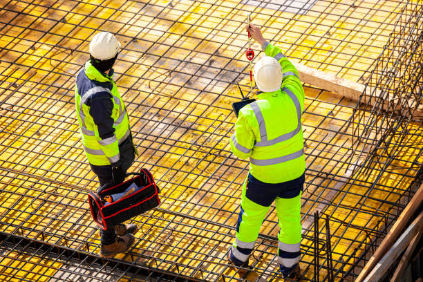 istock Surveyors at the construction site 1390815812