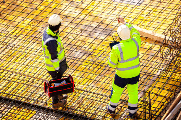 istock Surveyors at the construction site 1390815822