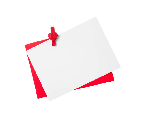 istock Blank card, envelope and red decorative clothespin on white background, top view. Valentine's Day concept 1390815939