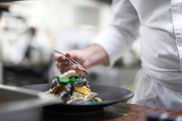 istock The head chef at a gourmet restaurant preparing for dinner service. 1390816820