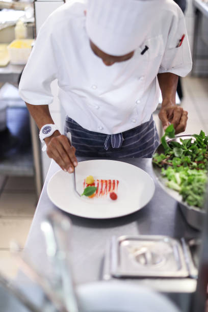 istock The head chef at a gourmet restaurant preparing for dinner service. 1390816896