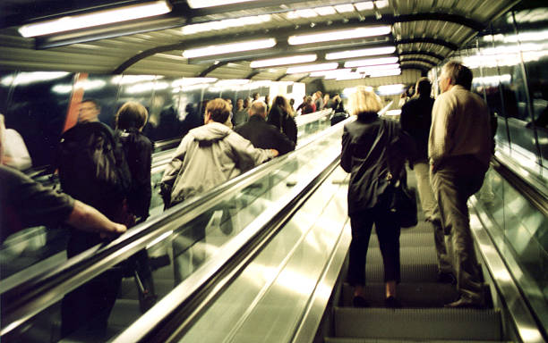 istock People on a moving sidewalk in a dimly lit area 139081744