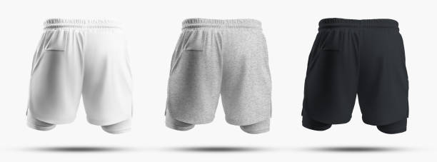 istock Mockups of sports men's shorts with compression undershorts 3D rendering, back view. 1390818167