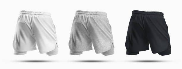 istock Mockups of sports men's shorts with compression undershorts 3D rendering, back view. 1390818407