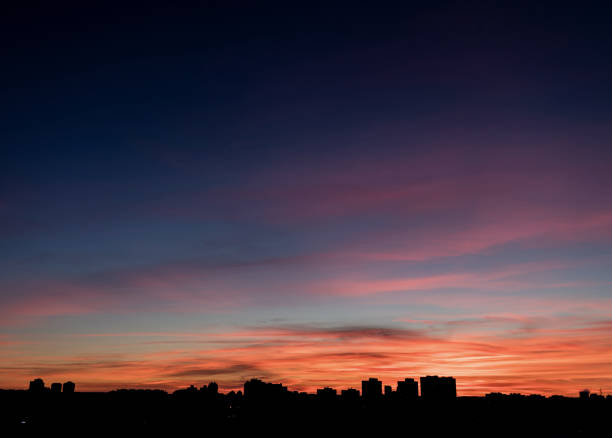 istock Beautiful sunset sky over city 1390818875
