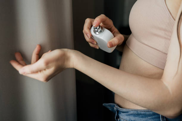istock woman apply perfume on her hand 1390819604