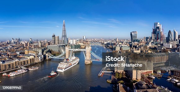 istock Panoramic aerial view of the skyline of London with the lifted Tower Bridge 1390819940