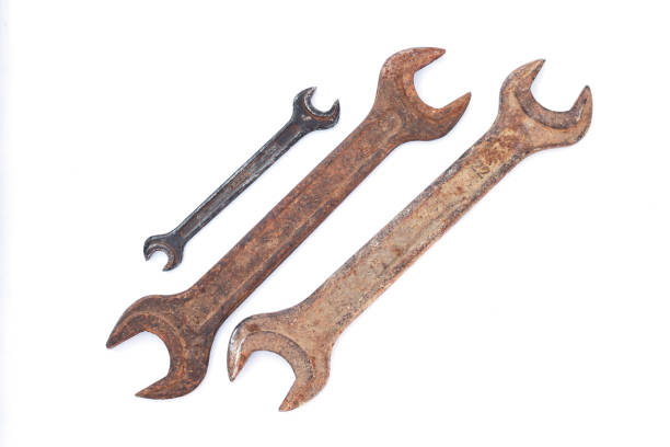 Set of different old dirty wrenches isolated on white background. Top view