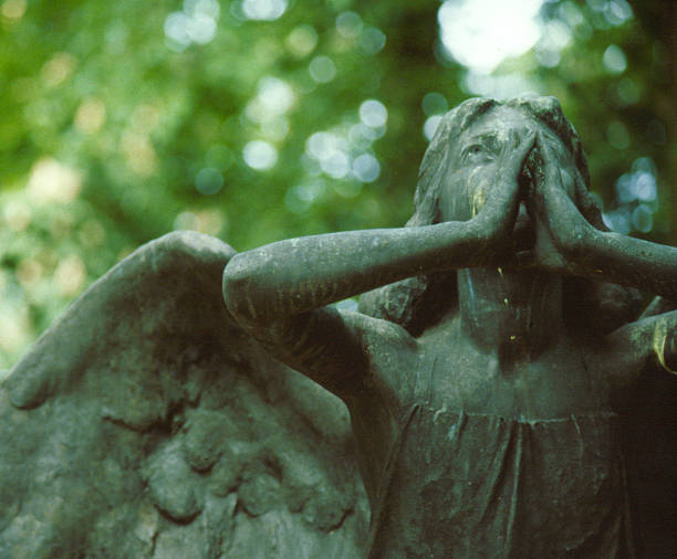 istock Stone angel tombstone 139082068