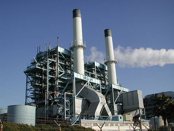 istock Industrial plant against blue sky with smoke trail 139082235