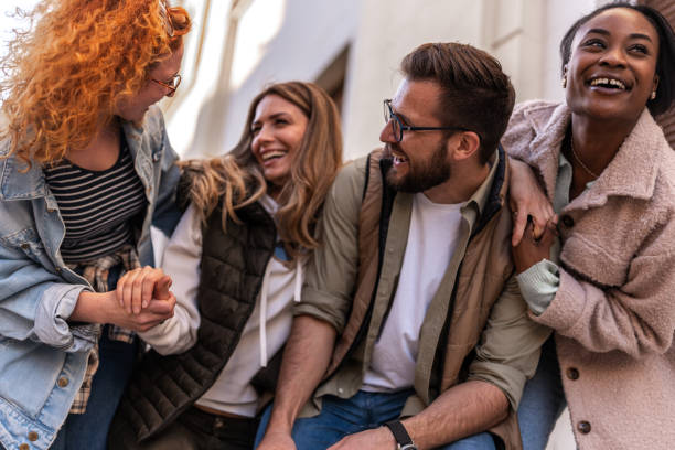 istock Young multietnical people walking and smiling 1390823376