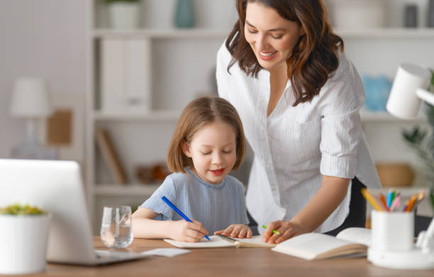 istock Girl doing homework or online education. 1390823594