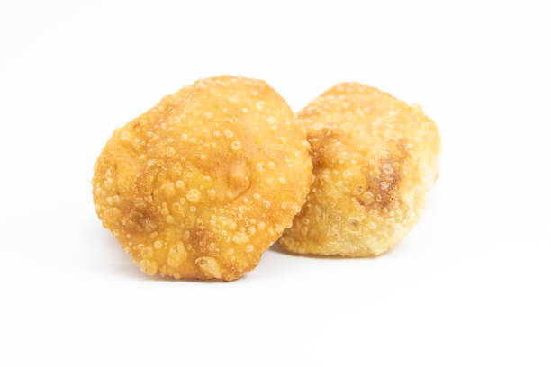 deep fried puri isolated on a white background stock photo