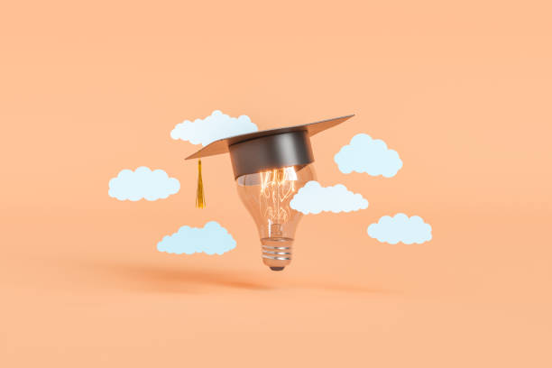 Glowing lightbulb in graduation cap among clouds stock photo