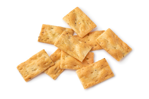 Heap of fresh traditional Italian Scrocchi, rosemary and sea salt crackers,  close up isolated on white background