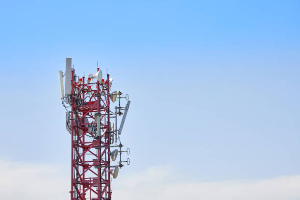 istock Telecommunications tower with many transmitters against the sky 1390829194