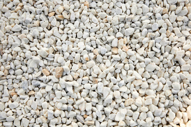 White decorative stones for arranging garden plots, white pebbles texture and background White decorative stones for arranging garden plots, white pebbles texture and background gravel stock pictures, royalty-free photos & images