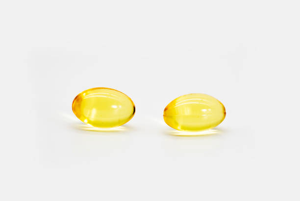 istock Omega 3 fish oil capsules also known as Cod liver oil isolated on a white background 1390830540