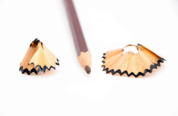 istock selective focus,pencil shavings on white paper background, 1390830675