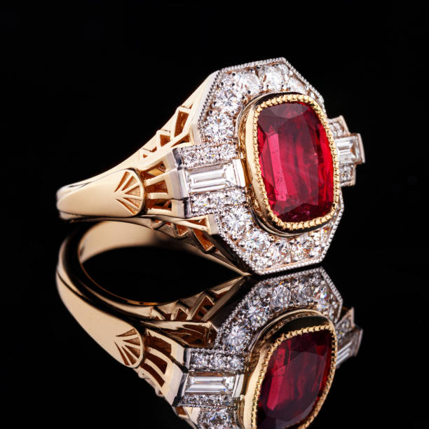 istock Beautiful yellow gold ring with a ruby on a black background 1390831761