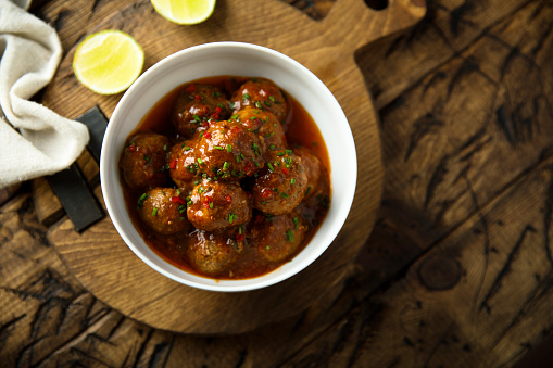 Homemade meatballs with tomato sauce and chili